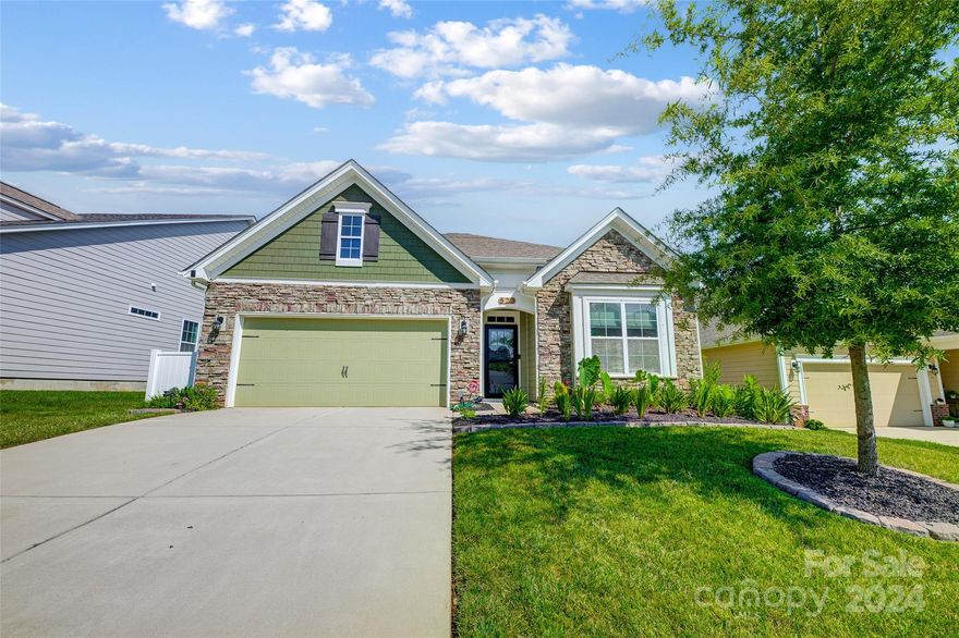 Gorgeous like-new home in an incredible location just over the bridge in Lake Wylie! Meticulously maintained, this ranch home features tons of upgrades including custom lighting, wood flooring, crown moulding and granite in all bathrooms! Get ready to prepare some incredible dishes in this gourmet kitchen w/oversized granite island, SS appliances and tons of cabinet space for storage. All in an open concept floor plan, simply perfect for entertaining! Primary bedroom features a tray ceiling and spa-like bath ensuite w/ dual sinks, soaking tub & stand-up shower & walk-in closet. Three additional large bedrooms perfect for family, guests, home gym or office space! This home is in INCREDIBLE condition and move-in ready. Dining area w/sliding glass door leading to covered back patio which has been extended and a new fire pit area to enjoy. Fabulous high-end community amenities, award-winning Oakridge school zone and tons of shops and restaurants nearby! You don't want to miss this home!!