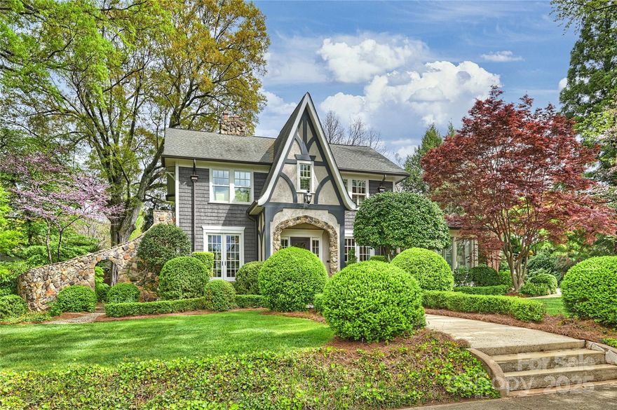 Quintessential 1925 Myers Park gem with two car attached garage, expanded and meticulously renovated to preserve its classic charm.  Owned by two of Charlotte’s most talented interior designers, this home showcases stunning custom features and thoughtful upgrades throughout. The entertainer’s dream layout offers inviting spaces, including a breathtaking rear terrace with a soaring ceiling, wood-burning fireplace, and integrated lighting and speakers. Upstairs, four spacious bedrooms and three beautifully renovated bathrooms await. The basement boasts an impressive wine cellar, while a spectacular studio sits above the garage. Lush landscaping and vibrant seasonal blooms frame the front and back. 812 Bromley is a home you’ll want to experience more than once—it will exceed your expectations.