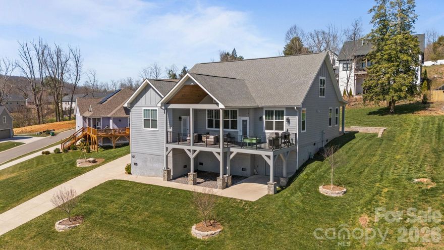 This beautiful 2021-built home blends modern design with mountain charm. Thoughtfully crafted with quality finishes and attention to detail, this move-in-ready home features an open-concept layout filled with natural light, creating bright and inviting spaces throughout. The spacious living area flows seamlessly into a well-appointed kitchen, complete with sleek countertops, stainless steel appliances, and ample cabinetry—ideal for both everyday living and entertaining. A generous primary suite offers a relaxing retreat, featuring an en-suite bath with a soaking tub and walk-in closet. Additional bedrooms, along with a dedicated home office, provide flexible space for guests, remote work, or hobbies. The fourth bedroom does not have a closet, but one could be added or an armoire could be used for clothes storage. Step outside to a partially covered deck where you can take in sweeping mountain views—perfect for relaxing mornings, evening sunsets, or hosting gatherings year-round. Conveniently located just minutes from shopping, dining, and outdoor recreation, this home offers the perfect balance of comfort, style, and accessibility. Biltmore Park and the Asheville Regional Airport are about a 10 minute drive and downtown Asheville and Hendersonville are just under 20 minutes. EV-ready with a convenient 240V outlet in garage. Don't miss this incredible opportunity to own this beautiful home in such a quaint and desirable neighborhood in Arden.