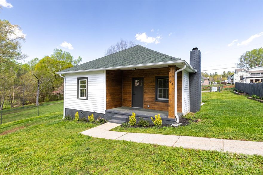 Get ready to be impressed w/ this 3 bd & 2 full bath Craftsman style inspired home which showcases rich character & timeless appearance from the first time you step into this beauty. Gorgeous hardwood floors throughout, living room features floor to ceiling brick wall centered by wood burning fireplace & recessed lighting positioned over the decorative suspended shelves to. The kitchen offers shaker cabinets w/ builtin pantry, quartz counters, under mount stainless sink, subway tile backsplash & decorative accent tile frames the stainless canopy style range hood vent. Main bathroom displaying tub w/ polish tile shower surround and tile floors.  The second full bathroom features above counter resin sink, shaker cabinet, floor to ceiling tile shower w/ accent shelf and frameless shower door. You will surely love the custom laundry/ mudroom offering built-in bench, locker cubbies perfect for organization. Covered front porch and fenced yard.  Large storage building included!!