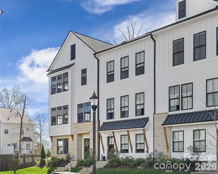 END UNIT townhome with attached 2 car garage and ROOFTOP balcony with spectacular sunrise/sunset views. Appreciate a home with natural light? Look no further. This thoughtful design offers expansive windows that flood the open floorplan with natural light. The home features 3 bedrooms, 3 full and two half bathrooms, and a spacious bonus room.  Elegant 5” hardwood floors span the foyer, great room, kitchen, dining area, walk in pantry and powder room. Custom craftsmanship details add an additional layer of luxury. Main level bedroom offers flexible options as private space for home office, exercise or guest suite. Ideally located in sought-after South Charlotte near Ballantyne and Stonecrest, this home offers the perfect balance of convenience and lifestyle. Enjoy walkable access to premier shopping, dining, fitness, lawn maintenance and everyday essentials while coming home to a quiet residential setting. Lifestyle and Location align perfectly at Elm Terraces.