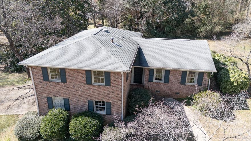 ONE OWNER! QUALITY CONSTRUCTION! ALL BRICK! This lovingly cared for home exudes quality, character and charm!  The sunny kitchen overlooks the back patio and treescape for ease of outdoor entertainment as well as beauty and natural scenery.  The main level flow is great for entertaining and offers, real wood floors and lots of windows. a few steps up..... 4 spacious bedrooms all with large closets and REAL HARDWOOD FLOORS under the carpet (one room has the carpet removed so you can see the condition and beauty!)  Several linen closets,a large primary bedroom ensuite, with walk in closet and attic nook all upstairs.  There is a cozy den in the lower level with real wood fireplace, built ins and driveway entrance. An oversized laundry room and attached double car garage w/ tons of storage also on the lower level - easy drop zone.  All situated on a corner lot with tons of outdoor enjoyment potential and located just minutes from schools, interstate, shopping and dining!