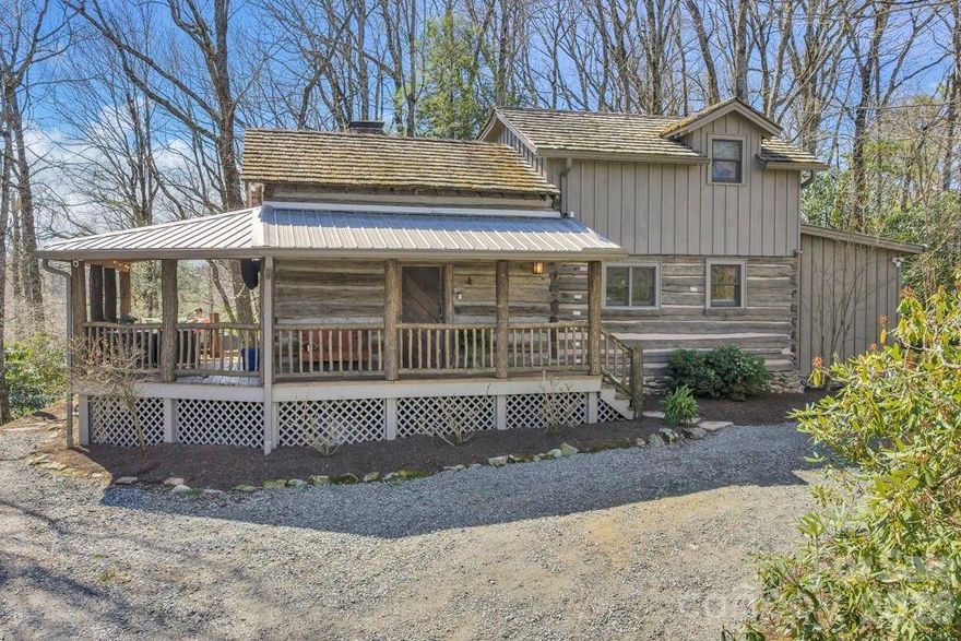 Presenting 572 Skyland View Drive, Blowing Rock- a rare find and truly unique and special property- previously featured in the Blowing Rock Tour of Homes! Nestled at the end of the road and in walking distance to shopping & dining on Main Street in historic downtown Blowing Rock, this two bedroom, two bath home is bursting with character and charm. Originally constructed around the 1840s, this Civil War-era cabin was relocated to Blowing Rock in the 1970s and later expanded and updated, now serving as the perfect full-time residence or mountain getaway with seasonal Blue Ridge Mountain views and a blend of history and authenticity, and modern convenience. Just a quick golf cart drive away from Blowing Rock Golf Course, and walking distance to the Town parks and paths that connect directly to National Park Service trails! Enter from the breeze-capturing, covered, wrap-around porch into the living room, featuring a vaulted ceiling, stone fireplace, and rustic charm, open to the dining area and kitchen with updated, stainless steel appliances and marble counters. The primary bedroom with walk-in closet, full bath with tiled shower, soaking tub, and double vanity with marble counters, as well as the laundry closet, complete the main level. Upstairs, a lofted sitting area overlooks the living and is adjacent to the second bedroom with vaulted ceiling, full bath, and large storage and utility closet. Outside, enjoy the cool mountain air around a stone firepit area that connects to the front porch and circular driveway. Ample parking, large exterior storage closet, low maintenance landscaping & wooded privacy, high speed internet!