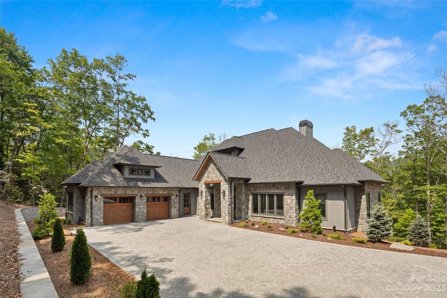 Contemporary and captivating! Completed in 2022, this ONE LEVEL HOME radiates luxurious
living from the moment you arrive via the generously sized, flat paver driveway. Once inside,
you’ll feel a sense of expansiveness with soaring ceilings, ample natural light, and a timeless,
neutral palette created with a variety of high-end finishes and natural materials. The gourmet
kitchen, with immense waterfall-edged island, is a chef’s dream. Take entertainment to the
next level and bring the outside in by opening the wall-to-wall accordion glass doors that lead
onto your oversized screened porch, complete with fireplace and outdoor kitchen. Enjoy a
more than gracious primary suite with its own screen porch with gas fireplace and retractable
screens, two walk-in closets and a primary bath that rivals the finest spas! A large office, two
well-appointed ensuites, walk-in pantry and generously sized laundry room with access from
hall and primary suite round out this exceptional home.