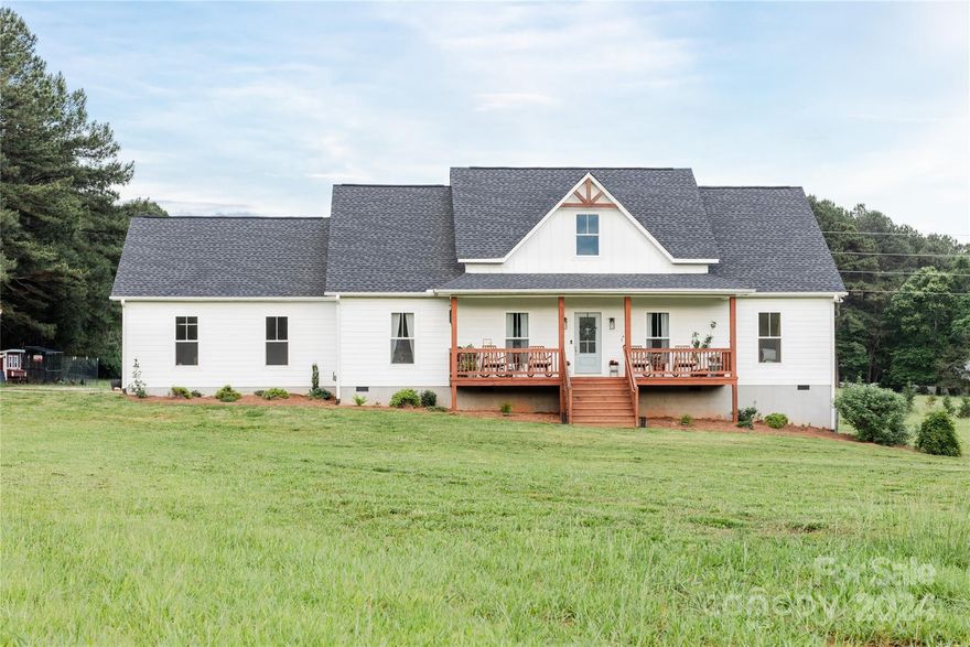 Price Improvement! Discover this exceptional craftsman-style farmhouse, now back on the market due to no fault of the sellers. Built in 2020 and spanning over 2,400 square feet, this stunning home is nestled within the highly sought-after Clover School District. Set on 7.81 acres with no HOA, it provides ample privacy and space, and the inviting front porch offers the perfect spot to take in breathtaking sunsets. The property is cultivated with a variety of trees adding charm and sustainability. Inside, you’ll find 4 bedrooms, 2 bathrooms, and an unfinished area ready for an additional bedroom and bathroom. The heart of the home is the kitchen, featuring custom cabinetry, granite countertops, and a gorgeous live-edge oak slab island. For hobbyists and entrepreneurs, the 1,100+ sq. ft. workshop with electricity and garage bay access is a versatile space for projects and storage. Don’t miss the chance on this unique property.