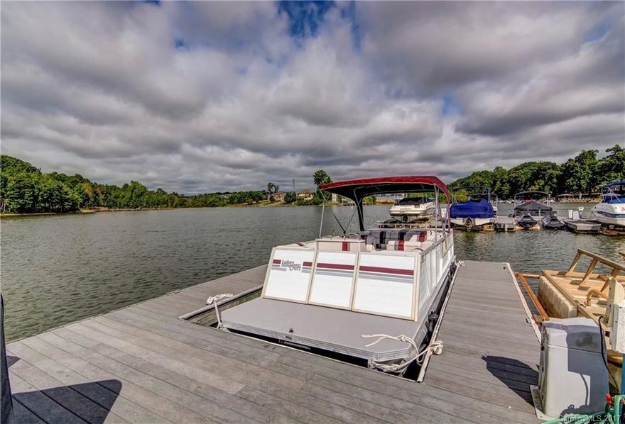 Enjoy the lifestyle of Lake Norman! This pristine, 4-BR (PLUS a Bonus Room) home comes w/ a DEEDED BOAT SLIP & community amenities including a lake-side pool. Features most notable are luscious new hardwoods, open floor plan, designer-style lighting, wide mouldings, plantation shutters & updated hardware throughout. In the kitchen are SS appliances, granite countertops & tile backsplash. The owners' bathroom is updated. too. The backyard is fenced. A/C is new. And the roof was replaced in 2011.