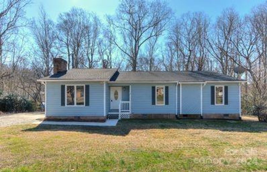 Serene country setting yet minutes from shopping, dining and downtown. This home offers 3 bedrooms, 2 bathrooms. Foyer has leaded glass insert front door & coat closet. Spacious living room features vaulted ceiling with exposed beams, floor to ceiling masonry fireplace. Roomy kitchen has ample cabinets & counter space, bay window at roomy breakfast area & bar. Formal dining room has sliding glass door to partially screened in porch & is open to breakfast area- what a great space for entertaining & big holiday dinners. Generous primary bedroom has new carpet & walk-in closet. Sliding glass door to partial screened back porch. Two additional carpeted bedrooms with sliding doors to shared bathroom- new vanity, mirror, lighting & energy efficient toilet. Spacious laundry rm off hallway- complete with a washer & dryer. Huge private partial screened in porch. New paint inside/out. carpet, plank flooring & double flush toilets. This home is move-in ready.    Home sold AS-IS.