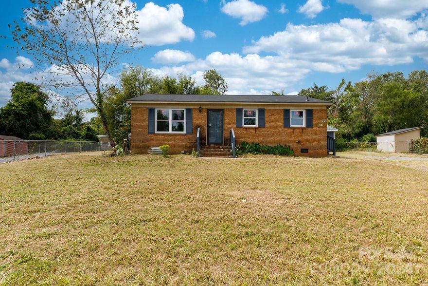 This beautifully updated 3-bedroom brick ranch offers modern comfort and charm. The home features a fully fenced yard and a huge detached garage/workshop, perfect for projects and storage. Recent upgrades include new windows, fresh paint, and stylish LVP flooring throughout. The kitchen shines with a sleek tile backsplash and new stainless steel appliances including a gas range.  The updated bathroom adds to the home's contemporary feel. Don't miss out on this move-in-ready gem!