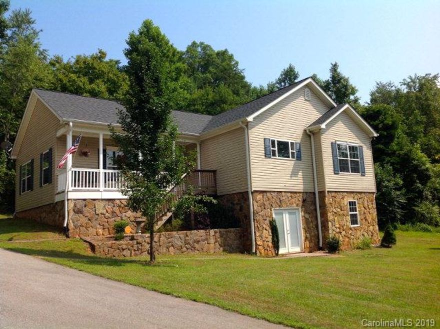 NEW HOME ESTATE  -- A quiet country setting is the site for this 3 BR, 2 BA Contemporary set on +/- 7.5 acres of some of McDowell County's most beautiful acres. It's a home that will make all of your toil seem worthwhile. Located on aprivate site that's only a short commute from town, the YMCA, & Greenway; this residence offers a great room w/ a rock fireplace and soaring ceilings to give a wonderful sense of spaciousness, a custom kitchen w/ center island, a master bedroom w/ private bathroom including a whirlpool-style tub, and a media room. The exterior features are excellent for either relaxing or entertaining & includes a front rocking-chair ready porch (views to Mt Mitchell) and a back deck. The bsmt finish has been started so the SF could be increased easily. LIST PRICE INCLUDES $3000 TOWARD BUYERS CLOSING COSTS and $1500 NEW PAINT