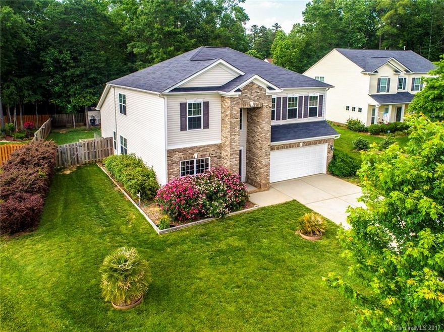 Come stretch out in this gorgeous cul de sac home. Snuggle up in front of the fireplace, relax in your private fenced backyard. Corian countertops, large island, tile floors and stainless steel appliances in the kitchen. Master bedroom on the main. All bedrooms feature walk in closets.