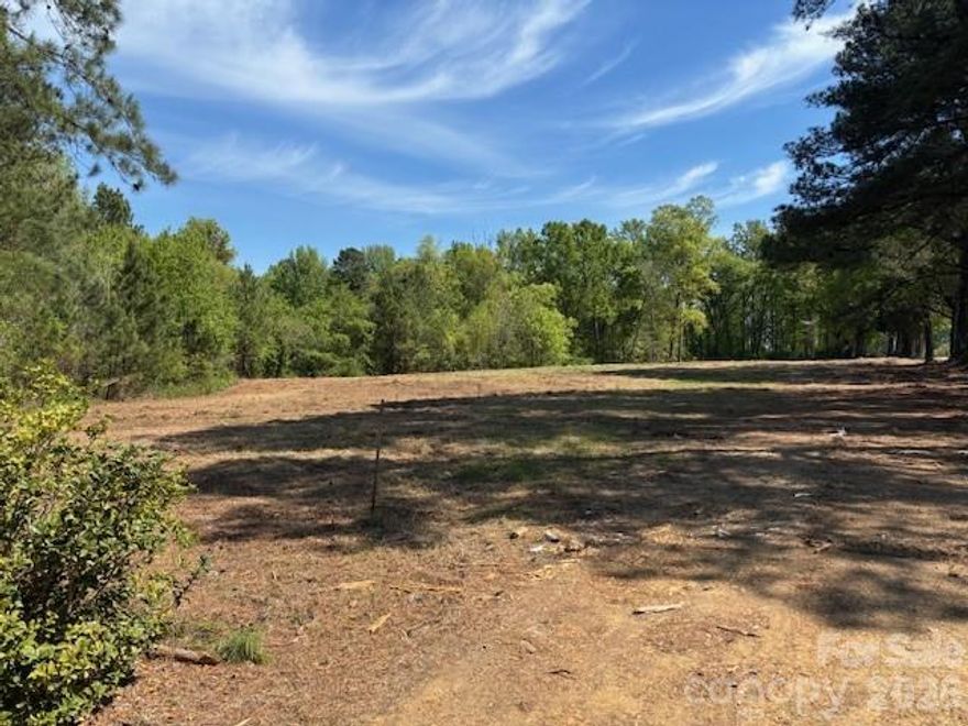 Lot 3 Ewart.  Prime Huntersville estate lot.  Bring your own builder.   Backs up to Northstone Country Club.   No HOA.   City water and sewer taps provided.  New park with walking trails, dog run and zipline planned nearby.  Convenient to Downtown Huntersville, Birkdale Village, Lake Norman, Uptown Charlotte and Charlotte-Douglas International Airport.  DOT is reviewing driveway options.