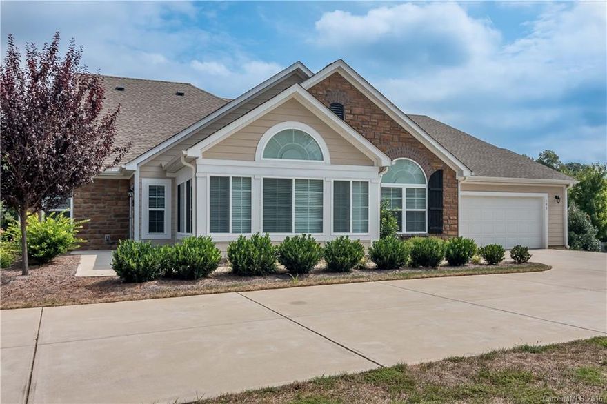 Beautifully updated  patio home in a great location.  Immaculate condition and well maintained.  Open floor plan.  Spacious 2 large bedrooms and 2 baths with ample closet and storage space.  Granite counter tops and stainless steel appliances.  Sunroom with ceramic tile floors.  Window blinds, programmable thermostat, humidifier.  55+ community with swimming pool, clubhouse, and fitness center.  End unit with large private driveway that is not shared with other units.