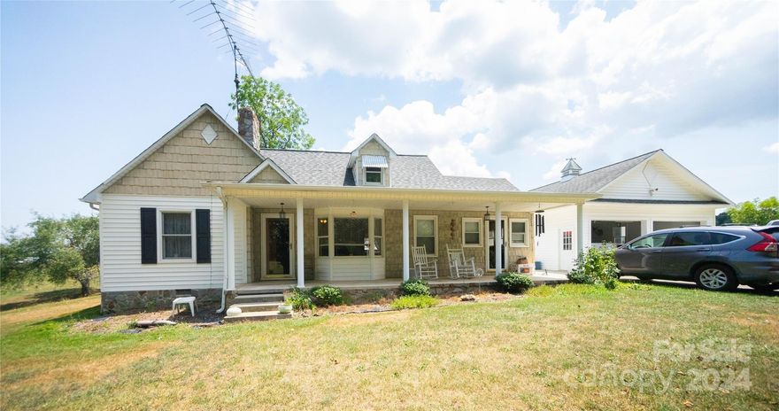 This charming countryside farmhouse is well maintained and offers modern comforts. It features a spacious living room, dining room, and a kitchen equipped with stainless steel appliances, including a refrigerator, dishwasher, built-in microwave, double wall oven, and cooktop. The washer and dryer are included. Home is heated by an outside water stove.

Outside, there is a detached two-car garage and a 50 x 40 workshop with a car lift on 2.28 acres. The unheated and uncooled upstairs offers potential for a bonus room and an additional bedroom. This home blends modern amenities with peaceful countryside living.