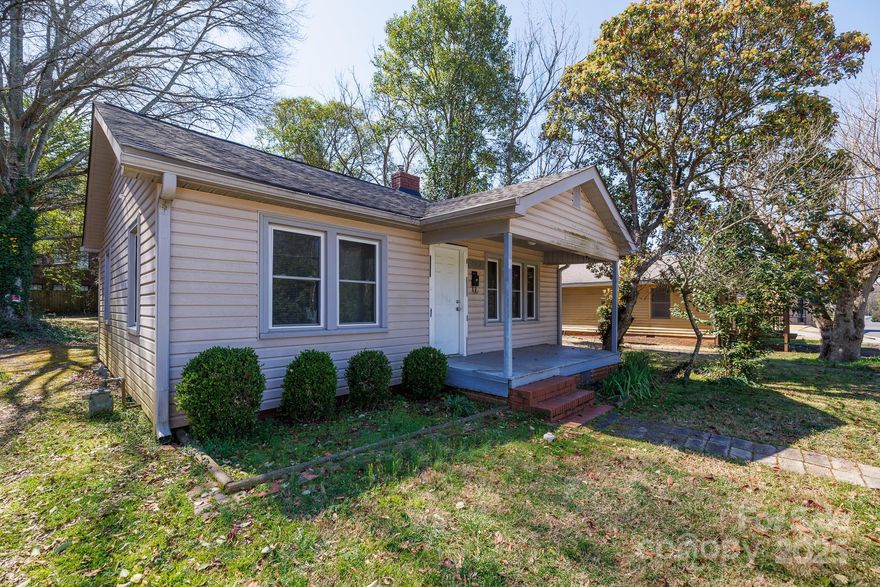 Charming 2-bedroom home in a prime Fort Mill location! This property features a welcoming front porch, a spacious rear deck perfect for relaxing or entertaining, and a tankless water heater. Conveniently close to downtown Fort Mill, it offers easy access to shops, dining, and local amenities. Zoned LC (Local Commercial), this versatile space allows for small shops or businesses—check zoning regulations for specific uses. Whether you're looking for a cozy home or a business opportunity, this property has great potential!  Cross-listed as commercial MLS# 4234188