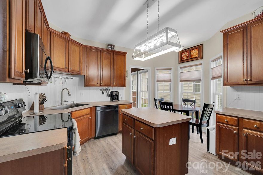 This charming corner-lot two-story invites you to live comfortably and conveniently, only moments from your favorite shops and restaurants. The main-level primary suite offers a peaceful retreat with a garden tub, dual sinks, and walk-in closet. Step out onto private balconies on each floor and take in the view of your fenced backyard oasis. Upstairs, a spacious loft provides flexible living space for work, play, or relaxation. A two-car garage with built-in cabinets adds great storage, and recent upgrades—including a new HVAC system and water heater—make this home move-in ready.