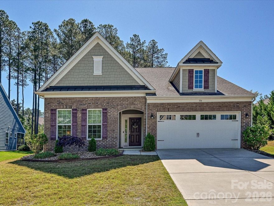 Welcome to your 4BR/3BA 1.5-story home in amenity-rich Imagery, a 55+ community where nature abounds on a peninsula of Mountain Island Lake! This 2,762 sf home offers a large Owner's Suite on the main level with a sitting area and a covered porch and 2 additional bedrooms. Enjoy an open floor plan with an extended Great Room, LVP floors, a Gourmet Kitchen with a gas cooktop, granite counters, stainless steel appliances, a huge island, and a walk-in pantry. Upstairs, you'll find a bedroom, a full bath, and a roomy family room with lots of storage. Walk out back and enjoy your brick paver patio and fire pit, or enjoy Imagery's pool, pickleball, tennis, beach, trails, waterside parks, arts studio, sewing cabin, fitness center, library, game room, and dog park. Lawn maintenance and an on-site Lifestyle Director are also included! A WATERFRONT PARK with BOAT DOCKS, JET SKI SLIPS, and KAYAK ACCESS IS UNDER CONSTRUCTION!  10 mins to local shopping and I-485, 20 mins to the Airport, Uptown, major shopping, restaurants, medical facilities, and Lake Norman. Under-55 buyers are welcome!