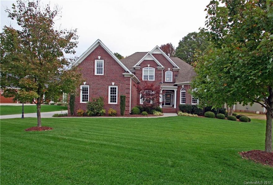 Immaculate well-maintained  bsmt home on golf course. Fresh paint inside/out. Notable gleaming cherry hardwoods, vaulted ceilings, granite counter tops & stainless appliances. 2 BR/2BA on main floor. Private screened porch & rear deck off the breakfast area. Upper level has 2BR's plus a bonus/bedroom. The lower level offers a BR/BA, media room, wet bar, playroom/exercise room, & a sitting area w/gas FP. Fenced-in level backyard w/outdoor gathering area & FP. 650sf storage space & bsmt shop.