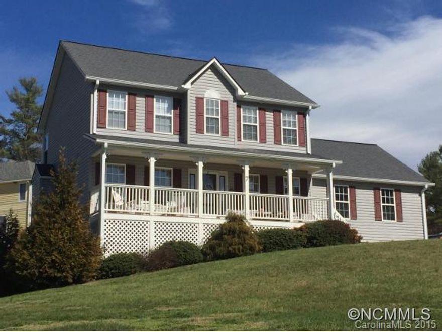 Enjoy beautiful year-round long range views from the covered front porch of this fantastic three level home in Weaverville. Minutes to downtown Weaverville and close to downtown Asheville. Three bedrooms on top level with bonus room in basement. Two gas fireplaces. Two car garage on main w/ additional garage in basement (perfect for lawnmower or ATV). Offering Home Warranty. Gorgeous home.