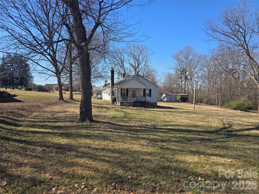 Charming older home located in Eastern Burke County! This 2-bedroom, 1-bath home features a spacious laundry/mud room at the rear of the property for added convenience. An additional walk-through room offers flexibility and could be used as a third bedroom, home office, or bonus space if needed. Enjoy the fresh feel of new LVT flooring installed throughout most of the home. A great opportunity with plenty of potential! Home does have a shared driveway. Wall oven in kitchen is not working. Cooktop and range in the mudroom is what's currently being used.