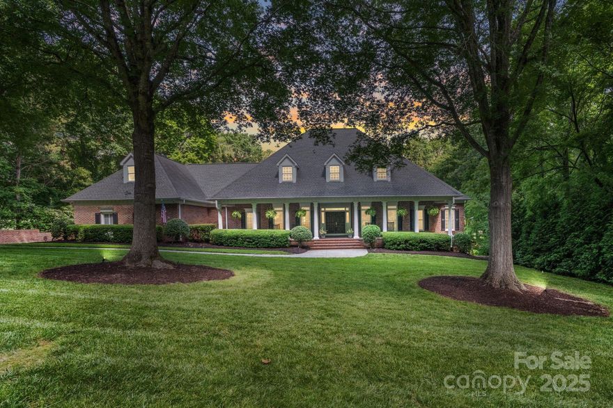 Newly renovated Luxury home retained its timeless character while creating space designed to impress in coveted Carmel Estates featuring golf course access to Carmel CC. Priced UNDER recent appraisal value: Home has been inspected and repairs complete- Back on market at not fault of seller; SHOW AND SELL! Main level includes 4600 sq ft with all-new designer kitchen and no detail overlooked. New 7" French white oak hardwoods are stunning. An elegant primary suite is a sanctuary of comfort, with floor-to-ceiling windows, serene new sitting room with fireplace and spa-inspired all new bath. End your day in the living room off the kitchen or entertain in the family room surrounded by windows and one of six fireplaces. Extend your entertaining space on the terrace overlooking a private setting of 1+ acre. There are five upstairs bedrooms plus a bonus room. A walk out basement includes full kitchen, exercise and rec room space with full bath and steam shower. Encapsulated walk in crawl. Walk up attic and abundant closets. 3 car side load garage. Schedule a showing today to live in South Charlotte's premier neighborhood.