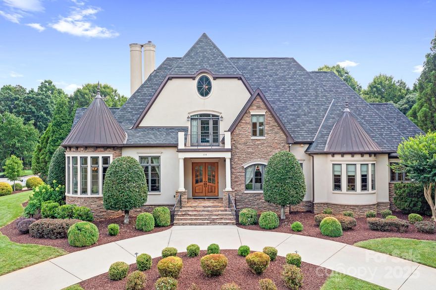 Quality craftsmanship shines throughout this beautifully designed custom French Provincial style home, which includes a deeded boat slip with lift (Pier Q-2) conveniently located across the street. Set on a private, fenced .80-acre lot, the backyard features a Pebble Tec pool/spa creating a peaceful outdoor retreat. Inside, the home offers the ease and convenience of main-level living, ideal for entertaining and everyday comfort and functionality. A chef’s kitchen features a large island with bar seating which flows into an open living room complemented by a butler’s pantry with wet bar and beverage refrigerator. The great room with French doors leads out to the pool for seamless indoor-outdoor living. The main floor features both the spacious primary suite and a secondary bedroom with an ensuite bath. Upstairs, two additional bedrooms with private baths-one offering French doors to a balcony. A huge walk-in attic provides storage/potential for future expansion.