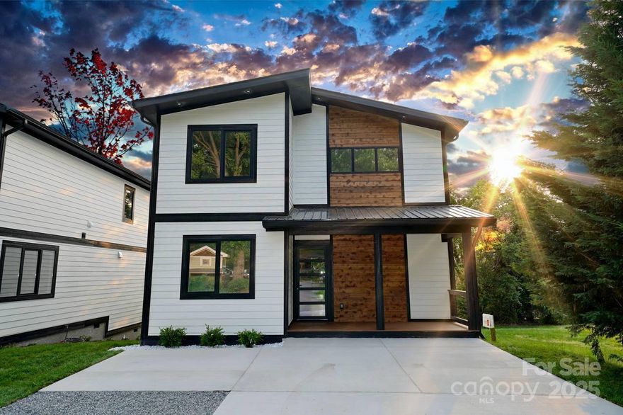 Welcome to this stunning brand-new modern home located in the desirable Oakley area of Asheville. This thoughtfully designed 3-bedroom, 2.5-bathroom residence includes a dedicated main-level office and blends style with function throughout.

Step inside to discover a bright, open-concept main floor featuring a dramatic floor-to-ceiling gas fireplace, a sleek waterfall kitchen island, and a spacious walk-in pantry—perfect for both everyday living and entertaining. Double doors lead to a private, fenced-in yard and a beautiful back deck—ideal for relaxing or dining outdoors.

Upstairs, you'll find all three bedrooms, including a spacious primary suite, along with the laundry room for added convenience.

Enjoy easy access to everything Asheville has to offer—just 5 miles to vibrant downtown, and only 1.7 miles to the Biltmore Estate, shopping, and local parks.

Don’t miss your chance to own a modern gem in one of Asheville’s most convenient locations.