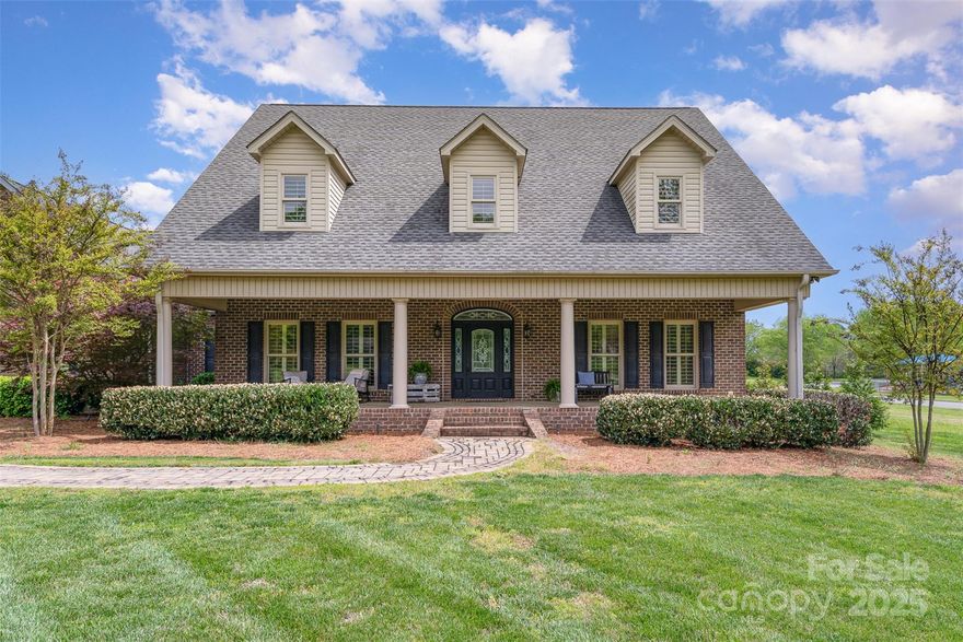 One-of-a-Kind Huntersville Estate with separate living space, Pool & Acreage! Welcome to 6419 Gilead Road—an incredible opportunity to own a custom full-brick home on a flat, private 1.27-acre lot minutes from Lake Norman. Check out the detached, heated/cooled garage with a 700 sq ft finished space above.  The main home features 3,464 sq ft with gleaming hardwood floors, a stone fireplace w/ gas logs, & a chef’s kitchen with GE Monogram appliances, gas cooktop, granite, & tiled backsplash. The remodeled owner suite (2021) includes dual vanities & closets w/ luxury finishes. Upstairs: 2 large bedrooms, 643 sq ft bonus room, and a huge WI storage room. 3 newer high-efficiency HVAC units, central vac, surround sound, plantation shutters, and Sonos system. Outside: covered porches, fenced-in SALTWATER pool, and an equipment shed. OVERSIZED 5 garage built for the way you live. No HOA!