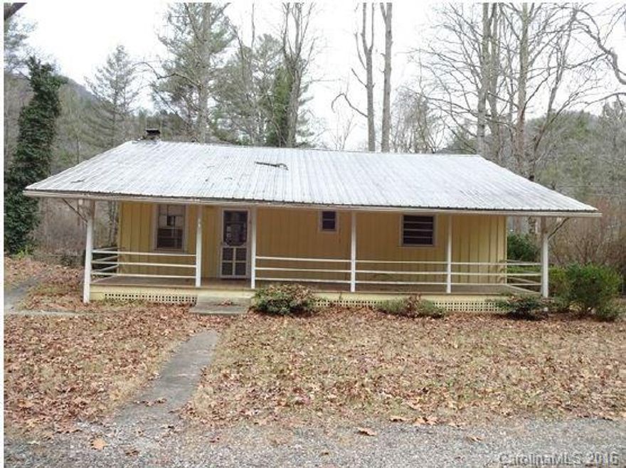 This cozy two bedroom home in Franklin, NC. is ready for some TLC from its new owner.  The interior has a great cabin feel with a huge loft. The lot is approximately an acre and has a lot of possibilities. Take a look here a this  rural home with a river running through its backyard. See it today.