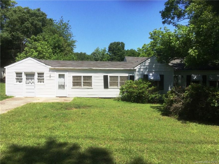 Zoned UD with many possible uses including residential. No city taxes! Great location for a small business. Additional lot in back available if parking is needed for trucks or trailers. Home to be sold "as-is". Possible window allowance with acceptable offer.