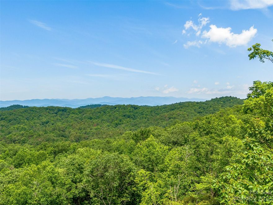 Discover a hidden gem nestled within the Big Hill community in Brevard, NC—a magnificent 3.54-acre wooded lot that promises an enchanting retreat. Immerse yourself in the breathtaking beauty of nature as you gaze upon the awe-inspiring 180-degree western views, capturing the splendor of the setting sun. The landscape unfolds before your eyes, revealing a tapestry of layered mountain views, each peak more majestic than the last. A gentle sloping building site invites your creativity and beckons you to design your dream home within this natural oasis. Embrace the tranquility of the surrounding woodlands, where mature trees provide shade and seclusion, ensuring a sense of privacy. This idyllic sanctuary offers an unparalleled opportunity to live amidst nature's wonders while indulging in the comforts of a serene mountain lifestyle.