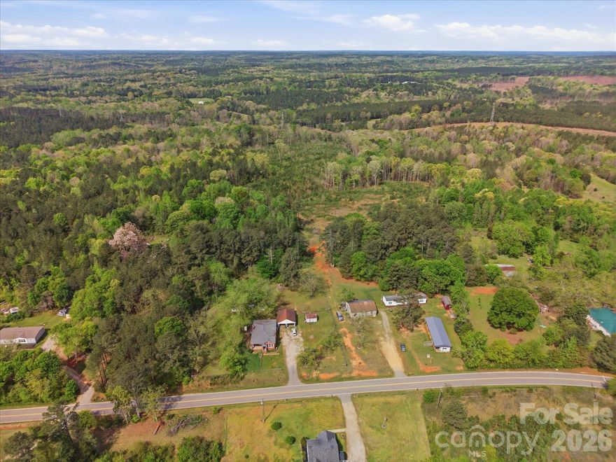 Set on nearly 22 acres of peaceful South Carolina countryside, this classic brick farmhouse delivers the rural lifestyle most people only dream about. Privacy. Space. Quiet. And a home with genuine character to match.
The timeless brick exterior, covered front porch, and sweeping views of open fields and mature trees set the tone before you ever step inside.
Inside, bright and airy rooms flow easily from one to the next. Three bedrooms, two baths, a generous living room, formal dining room, and a large kitchen give you all the space you need without feeling oversized. Original hardwood floors, soaring ceilings, traditional trim work, The bones are solid and the house has such character!  Major updates — windows, roof, and HVAC — have all been replaced within the last five years, giving you peace of mind.  Additionally there is a two-car carport as well.
Outside you will find nearly 22 acres of a beautiful mix of open pasture and wooded land means room for livestock, a garden, hunting, trail riding, or simply claiming your own private corner of the world. Whether you're envisioning chickens, a hobby farm, or just acres of your own to roam — this land is ready. 


Bring your boots, bring your animals, bring your imagination. Come on home!