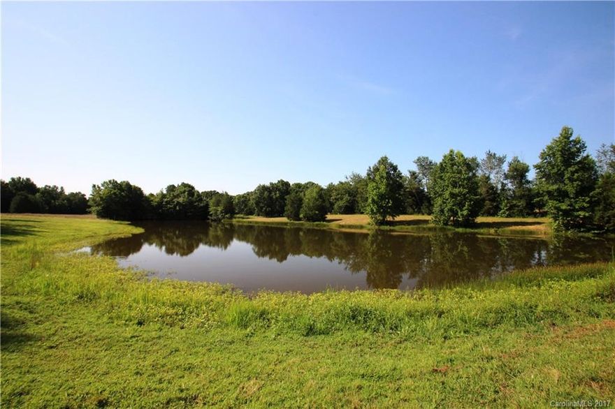 47.12 Acres Fully Fenced in with its own private pond.  Lots of open pasture and some woods.  The property features a 2 bedroom 2 bath home with a living room, Kitchen, dining room, and den that is being sold as it.  Horse barn with 6 stalls, hay storage area, and a tack room.  Several other small buildings as well. One other small horse barn as well.