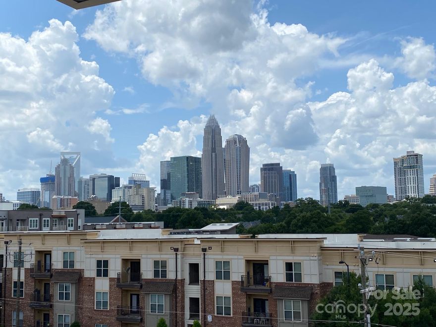 Views, views and more views!!  This is the first time a unit with a complete view of uptown Charlotte has been available.  Pulte had a wait list for this special building when they were first sold due to the demand.  This stunning townhome is absolutely gorgeous with an open floor plan, hardwoods throughout the entire unit and a rooftop terrace with a full view of Uptown. Four-story home with a chef's dream kitchen and island with seating.  Stainless steel appliances.  Huge master bedroom with large en-suite and 2 additional bedrooms with private en-suites.  Extra molding detail on the wall in living room and master bedroom. his home is designed for comfort as well as entertaining with two decks. Large garage with 2 tandem spots and storage. Located just short distance from restaurants, bars, Uptown, Plaza Midwood and Noda.  This is truly one of the best views that Central Point has to offer.  Don't miss this almost new townhome w/a million dollar views and best location. Agent owned.