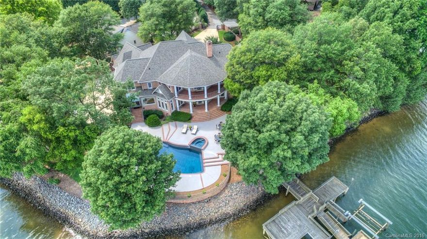 BREATHTAKING describes this amazing Lake Wylie estate. With over 240 feet of shoreline & unparalleled views of the main channel this property is one of the most INCREDIBLE locations on the lake and it is located right over the NC line!! This gated Estate features an open & elegant floor plan. Gorgeous curved staircase, Master & Guest Suite on main level. Kitchen opens to Great Room. Two Covered patios. Elevator, Guest suites w/full baths. Pool w/spa, level lot, dock, numerous upgrades. MUST SEE!
