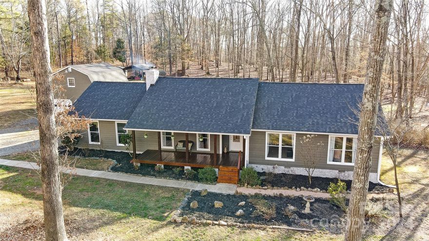 Welcome to your dream home nestled at the end of a tranquil private road on a sprawling 15-acre oasis! Located inside I-485, this property is only 13 miles to uptown Charlotte & 7 miles to PNC Pavilion and just 5 minutes to major shopping and restaurants!  Pride of ownership shows with the numerous updates to include new roof, HVAC, Paint, Bathrooms and more! Stainless appliances and gorgeous granite counter tops in Kitchen and Baths.  Hwd flooring in vaulted GR, Dining and Foyer.  GR has cozy wood burning stove and wood storage niche.  Open and spacious floor plan. All rooms are generously sized.  Private Study off of Bonus Room, separate laundry with sink vanity & upper cabinetry.  Enjoy everything nature has to offer whether enjoying the inviting front porch, the new rear deck or the fire pit.  Oversized 2 car gar with huge walk up loft space adds additional room for storage or workshop.  25' Tractor shed and 2nd storage shed.  Meck Cty taxes only - no city taxes and no HOA!