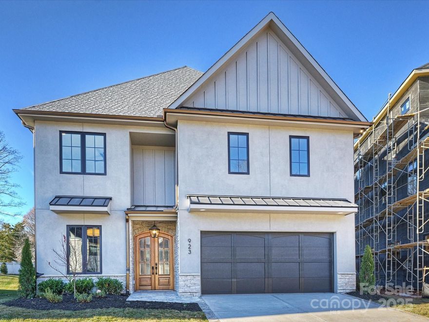 Stunning design in a new gated community that's convenient to all South Charlotte has to offer! This home was designed for entertaining, with high ceilings, custom cabinetry and designer finishes. The large chef's kitchen is open to the spacious great room, anchored by the gas fireplace. The kitchen features custom oak cabinetry with a Jennair 6-burner double-oven range, refrigerator/freezer and dishwasher. The adjacent scullery provides additional storage and prep space, the 2nd dishwasher and beverage refrigerator. A covered patio off of the dining area includes an additional gas fireplace, and overlooks the landscaped back yard. The main-level office/guest room conveniently has direct access to a full bath. The upper level includes the Primary Suite with a spa-like bath and 2 closets, a generous laundry room, plus 3 additional bedrooms with ensuite baths. The 3rd floor includes a pre-wired media room, plus the 5th bedroom and a full bathroom, and great storage space. Please note - the brick wall at the rear property line will be completed, gates at either end of the street are in the process of being installed and will be operational in 2026. The community is an active construction site, please use caution when driving through. Tax value is based on the lot value only.