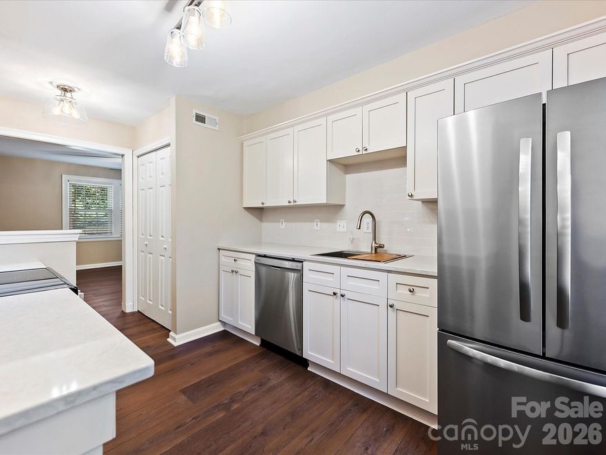 Discover elevated living in the heart of Eastover—just moments from Uptown Charlotte’s dining, shopping, and energy. This fully renovated one-bedroom, one-bath condo delivers style, function, and true move-in-ready ease.

The kitchen shines with quartz countertops, subway tile backsplash, refinished cabinetry with crown moulding, and a full suite of new Frigidaire stainless steel appliances. A Whirlpool washer and dryer in the unit add everyday convenience, while updated lighting and ceiling fans brighten every corner.

Throughout the home, you’ll find updated vinyl windows, custom blinds, interior paint, and premium luxury vinyl plank flooring that creates a seamless, modern feel. The bathroom has been refreshed with fixtures, resurfaced tile, and batten board detailing for a clean, designer-inspired finish. Classic Eastover character meets contemporary upgrades!