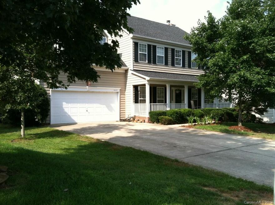 .48 acres!  Spacious fenced rear yard with wooded area. New porcelain tile in the kitchen, laundry, and bathrooms, Main floor has Pergo floors and porcelain tile (in kitchen, laundry, and bath), and 2nd floor has carpet and tile in the bathrooms.  Covered front porch. Two car garage with extra storage space. Separate AC units for each floor (one up and one down).  Cul-de-sac, quiet street!  Large community pool, playground & tennis courts! Must see to appreciate.