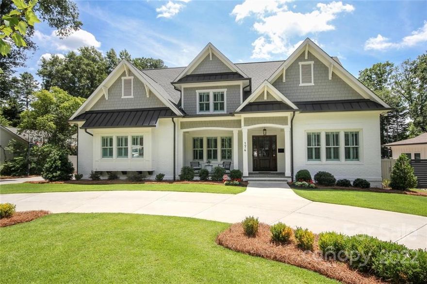 Stately, four-sided architecture in this custom designed home in Cotswold.  Beautifully landscaped .45 acre lot, with circular driveway and gorgeous outdoor living area - covered porch with space for dining and seating surrounding an outdoor fireplace as well as built-in gas grill and fire pit. See attached plans for pool. This home is ready for your buyers. Primary bedroom on the main with spacious, spa-like bathroom and 2 large custom closets - one w/ stackable washer and dryer.  Another laundry room upstairs with 4 nicely sized bedrooms and 3.5 baths.  Gourmet cook's kitchen with large island, huge pantry w/ second fridge. The Morning Room/breakfast room/playroom off the kitchen is multifunctional.  Sunny study/office on main. Hardwoods throughout upstairs and downstairs, 2 walk-in attic spaces. Drop Zone, attached, side-load, 2-car garage. In-Ground basketball goal ready for your next game of HORSE.  Schedule a showing today!