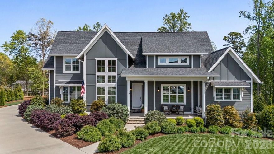 Luxury living under $1 million in one of Mooresville’s premier communities, The Estates at Oak Tree Ridge. Tucked away on a private 0.70-acre cul-de-sac lot, 144 McNeil Lane offers beautifully updated indoor and outdoor living, exceptional entertaining spaces, and timeless style. Built in 2022, this move-in-ready home blends comfort, elegance, and convenience in an ideal location.

The outdoor living area is a true standout, featuring extensive landscaping, a screened porch, stone patio, fire pit, grilling area, swing, fenced backyard, irrigation system, and a garage-access barn door that creates the perfect setup for entertaining or relaxing at home.

Inside, the home is filled with thoughtful upgrades, including plantation shutters, enhanced molding and trim work, shiplap accents, exposed beams, vaulted ceilings, custom cabinetry, and built-in shelving. The open-concept kitchen and family room create a warm, inviting main living space designed for both everyday living and entertaining. The kitchen features a large island with a farmhouse sink, gas cooktop, wine bar with wine refrigerator, and a side bar area that opens to the outdoor living space.

The main-level office includes a glass entry door and built-ins, while the mudroom off the garage offers custom shelving for added functionality. An oversized laundry room includes built-in cabinetry and a sink.

The primary suite on the main level is a private retreat with vaulted ceilings and exposed beams. Hardwood floors extend throughout both levels, and plantation shutters add style throughout the home. The spacious primary bath features tile finishes, quartz countertops, a garden tub, a separate walk-in shower, and a large walk-in closet with custom organizers.

Upstairs, you’ll find three additional bedrooms, a sitting area, and a spacious bathroom with double sinks and a separate shower.

Conveniently located near shopping, dining, I-77, and Lake Norman, this home offers the perfect blend of luxury, comfort, and convenience. Come see for yourself what this home has to offer!