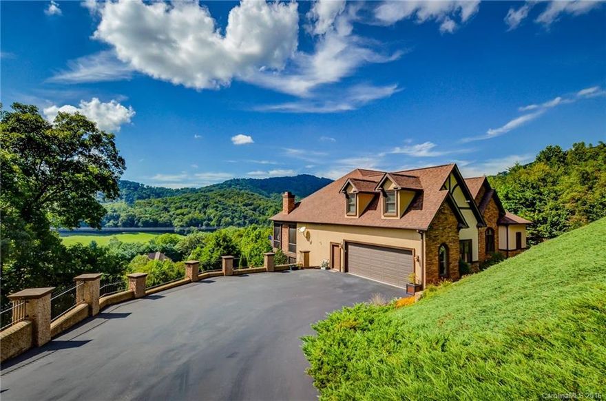 Stunning, Immaculate custom built home upgraded to the Max! Like to entertain?  The screened-in porch with fireplace leads to main deck offering breathtaking sunset views! Lower level features theater room, kitchen/bar area plus- covered outdoor summer kitchen/bar and deck w/hot tub! Main level with Walnut hardwood floors, gas fireplace, crown molding, tray ceilings, 8" baseboards. Gourmet kitchen, double ovens, gas stove and butlers pantry. Zoned top-rated TC Roberson school district. Must See!