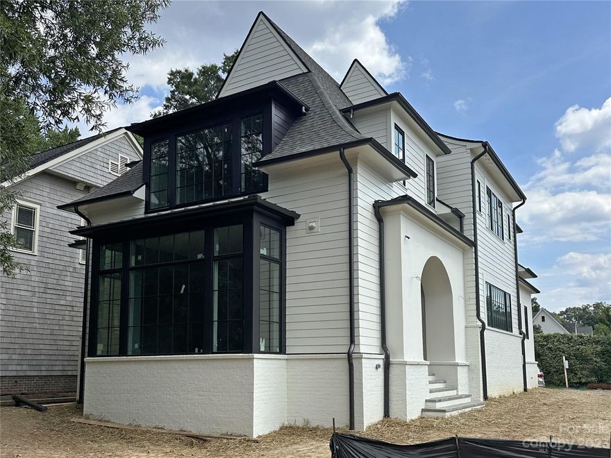 This spectacular home built by Knight Residential Group, designed by Aaron Cote Architecture and interior selections by Brooke Adler Interiors exudes luxury and sophistication. Desirable floorplan for effortless entertaining and everyday living. This home boasts a show stopping chef's kitchen that overlooks a spacious family room with fireplace. Primary suite on second floor features beautiful bathroom and dual walk-in closets. Three additional bedrooms, two additional bathrooms, and laundry on second floor. Third floor includes 5th bedroom, bathroom, office and rec room. Convenient to Park Road Shopping Center shops, restaurants and greenway.  Easy commute to Uptown.