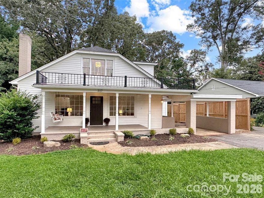 Main Level Living with Stunning Updates in Downtown Hickory's Oakwood District

Step inside and experience thoughtful design at every turn. The main level features an open-concept living room and home office with generous windows that frame views of the charming covered front porch, a formal dining room, and a beautifully appointed kitchen with island bar seating and a casual breakfast area. Retreat to the spacious primary suite, complete with an elegant tray ceiling, a luxurious en-suite bath, and ample closet space. Two additional main-level bedrooms share a beautifully tiled hall bath.

The upper level offers two bright, inviting rooms with hardwood flooring, generous closet space, and abundant natural light. A full bath with gorgeous tile work and a tub/shower combination completes the level. Please note: upper bedroom ceiling heights are approximately 88" and upper bath/landing ceilings are approximately 82".

Outside, enjoy a classic covered rocking chair front porch, attached carport, and a generous back porch with a level, fenced backyard.

The interior upgrades are truly something to see in person — this is a must-schedule showing.

Location & Lifestyle: Ideally situated between Downtown Hickory and the highly anticipated OLLE Art District, this home places you steps from a vibrant and growing community destination for the arts, eclectic shopping, pottery studios, outdoor gear, and home furnishings. The OLLE corridor is also set to connect to Hickory's expanding trail network as part of the city's Crafting Hickory Initiative — a multi-use path linking neighborhoods, green spaces, and downtown.

Transportation & Connectivity: City-maintained streets and sidewalks, Greenway public transit, and easy access to Hickory Regional Airport — home to the newly opened Hickory Aviation Museum. Charlotte Douglas International Airport is approximately 52 miles away. And yes, you may catch the nostalgic rumble of a freight train passing through downtown — a charming reminder of the area's rich heritage.

Local Attractions: Enjoy Lake Hickory with public access, Hickory Crawdads Minor League Baseball, Hickory Community Theatre, city parks and trails, splash pads, and a thriving dining and shopping scene.

Whether you're new to the area or a local ready for your next chapter — welcome home.