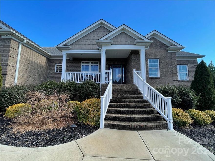 One level, five acres, located outside the city! So much privacy! Pines planted in front & behind the home make this location quite the refuge.This truly is a must see!
This home has so many wonderful features! Open floor plan w/ primary on main that boasts a spacious sitting area and large primary bath. Enjoy double sinks, two separate closets, and a large walk-in shower. You'll love the gorgeous kitchen w/ granite counters, stainless appliances. Double wall ovens & hidden microwave are just a few touches that make this home special. Fantastic pantry w/ so much storage. Large laundry room off the kitchen has ample space to act as a mud room as well. Notice the storage over each of the bays in your 3 car garage. Three additional bedrooms to use as needed. Office? Flex space? Home gym?  So many options. Wonderful front and back porches for taking advantage of tranquil views. Lots of closet space in this spacious home, but if you want more storage, check out the 30x30 building in back!