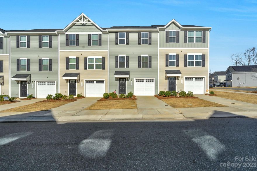 Dillon Lakes 3-story, 3 bedroom and 2.5 bathroom townhome with desirable open floor plan. Built 2021, this like-new home offers three spacious levels of living. Main floor offers great room and  kitchen with stainless appliances. Upper floor bedrooms including primary with en-suite and walk- In closet along with two full size bathrooms. The lower level includes a flex space that’s  ideal from in-home office. There is a one car attached garage, back patio and vinyl privacy fence. Refrigerator will convey. Community playground. Convenient to I-77, I-85, Uptown, Charlotte Douglas International Airport, UNCC, shopping and dining.