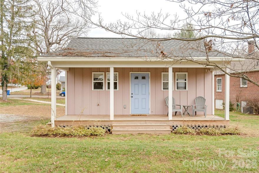 Welcome to your perfect Hendersonville retreat! This charming studio-style cottage offers the ideal blend of comfort, convenience, and investment potential—all within walking distance to vibrant downtown Hendersonville.

Thoughtfully designed, this fully furnished home features a cozy yet functional layout complete with a kitchenette equipped with stainless steel appliances, a dedicated workspace nook, and a comfortable living/sleeping area. Step outside onto the covered porch and enjoy peaceful city views, all framed by your own quaint white picket fence.

Whether you're looking for a personal getaway or an income-producing property, this home delivers. With a strong rental history and approximately $21,000 in rental income in 2025, it’s a turnkey opportunity ready to go.

Just minutes from the charm of Main Street—featuring local dining, boutique shopping, and live music—and a short drive to the Blue Ridge Parkway and Pisgah National Forest for hiking, waterfalls, and outdoor adventure.

A rare opportunity to own an affordable slice of the mountains with built-in income potential!