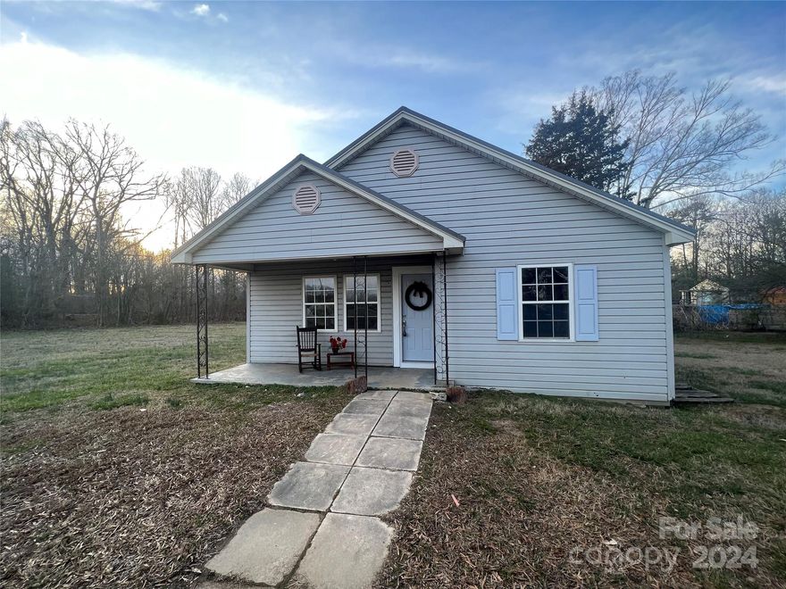 Rare Find! This charming bungalow is nestled on approximately 1.31 acres. It offers fresh paint and flooring with a neutral pallet. The kitchen cabinets have had an uplift with fresh paint.  The bathroom has had an uplift with installation of a new toilet and fresh glaze on the tub. A new front door was installed and painted. The dining room offers ample space and is open to the kitchen for easy entertaining. There is a circular driveway for plenty of parking space. The owner has an extra parcel of land (approximately 1.39 acres in size) that is adjacent to this parcel that she would consider selling if a buyer wishes to have increased acreage.  Schedule your private viewing today!