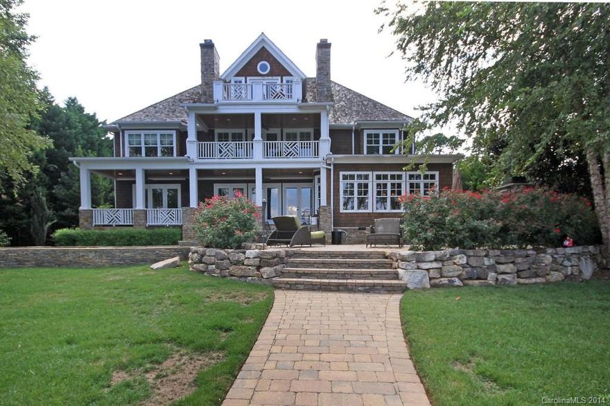 NEW PRICE!  Hurry!  A MUST OWN Patrick Joseph CUSTOM built Cornelius LKN WATERFRONT w wide lake views, salt water pool, hot tub, dock w lift, 3 car garage, MASTER ON MAIN, wonderful floorplan, 3 fireplaces, white oak flooring, custom granite, Wolf Stove, Sub Zero refrigerator, outdoor fireplace AND a SEPARATE LIVING SPACE W SEPARATE ENTRY OVER THE GARAGE!  We have it all here!   (Separate apartment over garage is represented as Lower Level square footage in MLS).  Coffered ceilings!