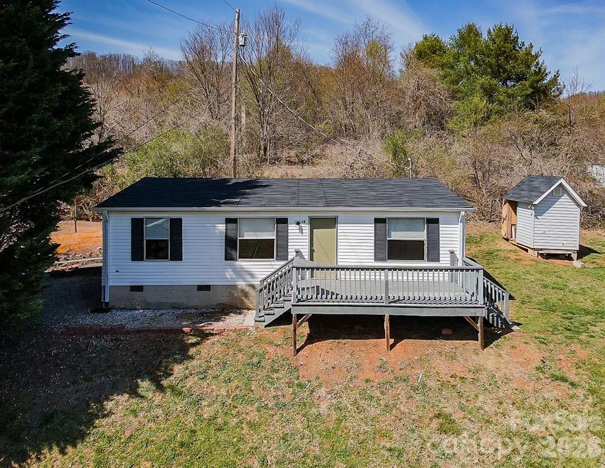 Located on a quiet private street, 10 Lands End Drive offers a fantastic opportunity for investors or buyers seeking peaceful mountain living with immediate income potential. The home has 2 bedrooms and 2 bathrooms plus a bonus room and sits on a generous 0.42-acre lot, featuring a nice flat, green yard—perfect for outdoor enjoyment, gardening, or pets.

The home includes a comfortable layout with a spacious primary suite complete with an ensuite bath and walk-in closet. Enjoy the best of outdoor living a on the large deck - an ideal spot to relax and take in the surrounding mountain setting and wildlife. A detached shed and large barn provide additional storage for tools, equipment, or hobbies.

Currently occupied by a long-term renter for $2,000/month, this property offers steady, turnkey income from day one. Whether you’re looking to expand your investment portfolio or secure a home with future flexibility, this property delivers both value and potential.

Conveniently located just 1 mile from Pisgah Highway (NC-151), you’re only 10 minutes to Candler shopping and dining and approximately 30 minutes to Asheville—combining accessibility with a peaceful, private setting.

Also available as part of a package with the neighboring home at 6 Lands End Drive (see Listing #4371930), presenting a unique opportunity to live in one and rent the other—or maximize returns by leasing both.