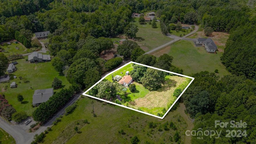 PRICE IMPROVEMENT! Look no further for the perfect slice of Americana. This stunning 1 acre lot is located in Fort Mill, but only pays the low York county taxes. The existing home could potentially be fixed up, but is being sold, "as-is". Just imagine the peaceful countryside lined with beautiful heritage oak trees. It's only minutes from all of the amenities that Fort Mill has to offer and did I mention the schools? Zoned for the most highly rated Fort Mill schools (River Trail, Forest Creek, Catawba). This opportunity lands you close to the beautiful new neighborhoods of Lost Rabbit & Wilson Farms. This home and land has never left the original Wilson Family! Don't hesitate, opportunities like this rarely present themselves. This home may qualify for 203k rehabilitation loan, ask for details from the listing agent.